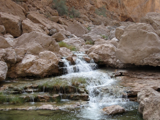 Flowing wadi above As Siwayh, Oman